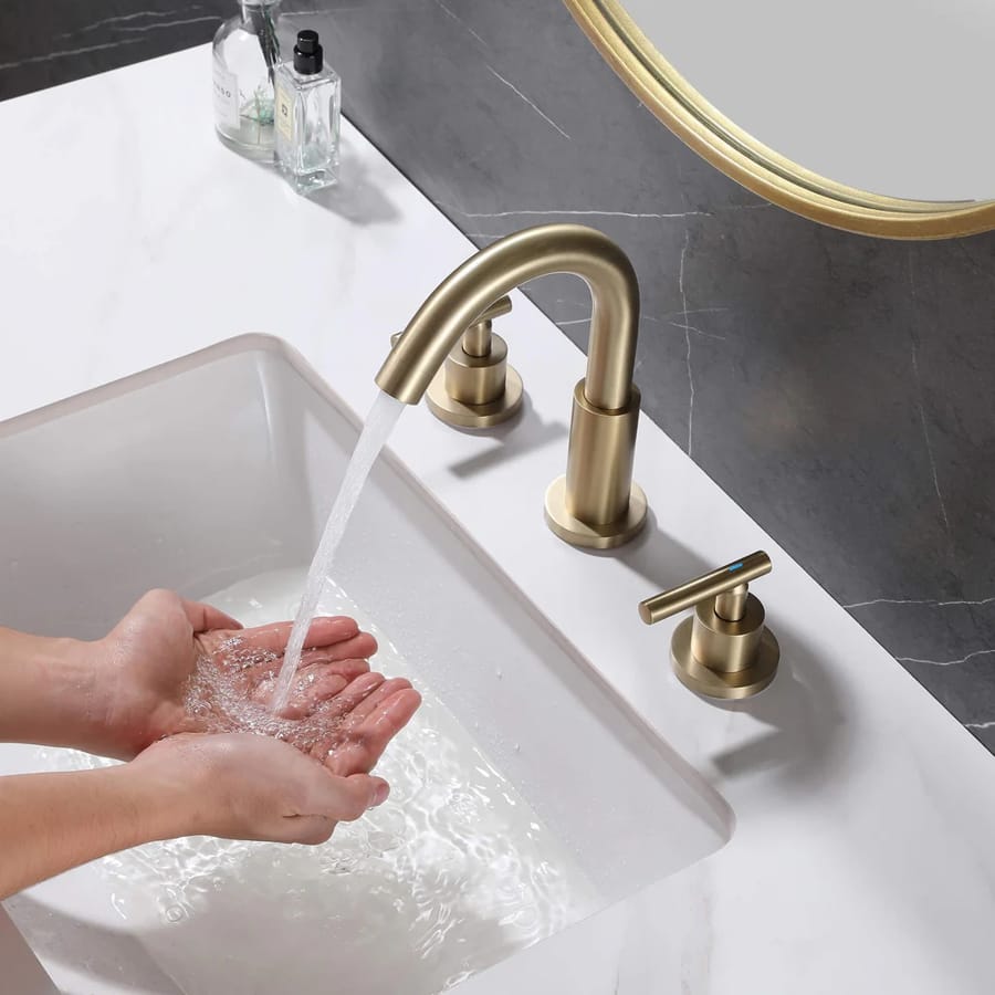 Baterie aurie modernă pentru chiuvetă de baie cu două mânere