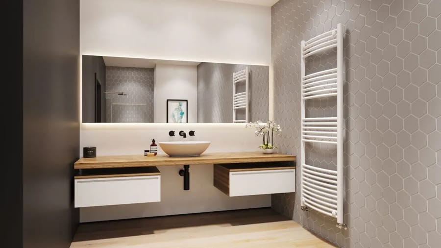 Radiator port prosop alb, montat pe peretele unei băi moderne cu decor hexagonal