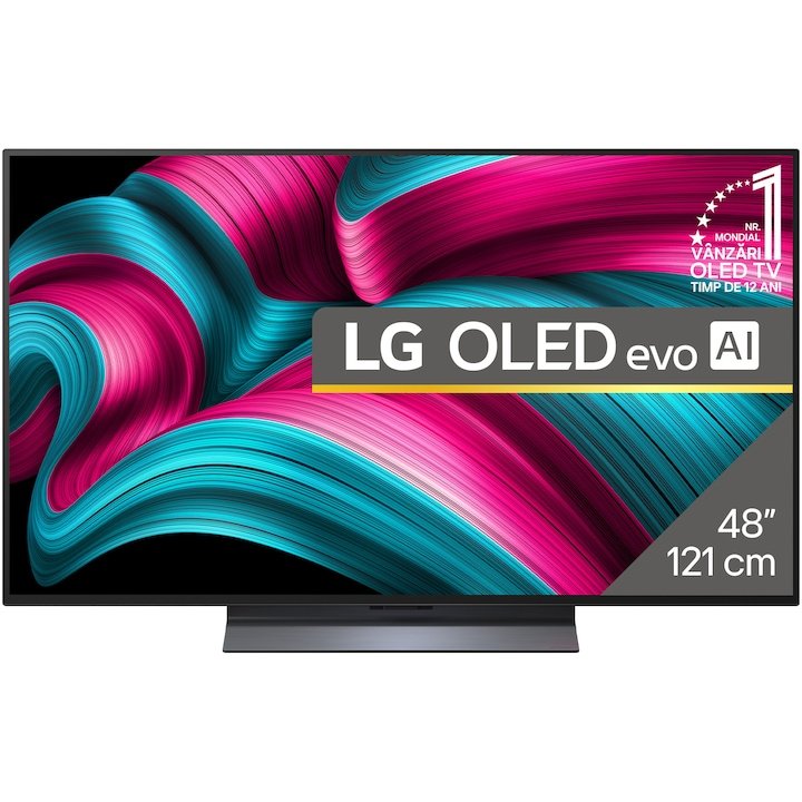 LG OLED evo C5 48C52LA pe birou de gaming cu consolă PS5 și controler, cameră cu lumină ambientală redusă