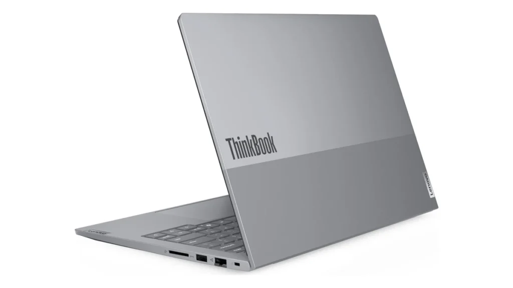 Laptopul Lenovo ThinkBook 14 G8 IAL deschis, văzut din spate și din stânga, cu capacul gri din aluminiu și porturile din lateral