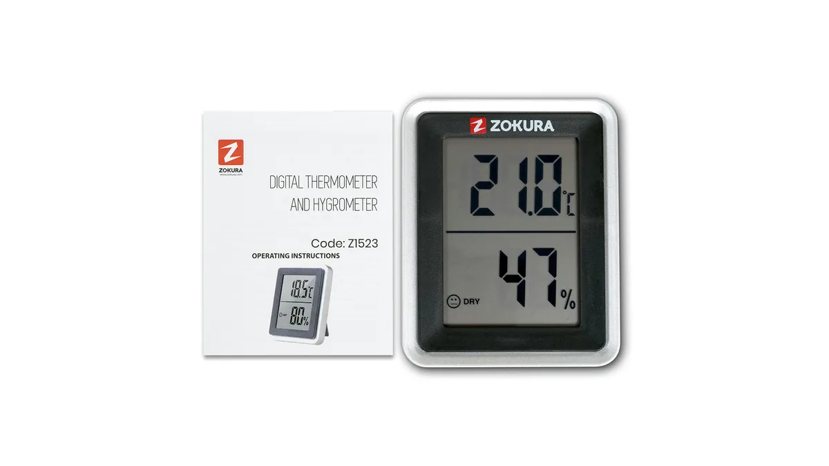 Termohigrometrul Zokura Z1523 alb, cu ecran mare, lângă cutia lui